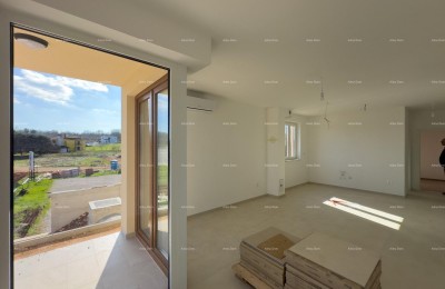 Wij verkopen een appartement met een grote tuin in Barban.